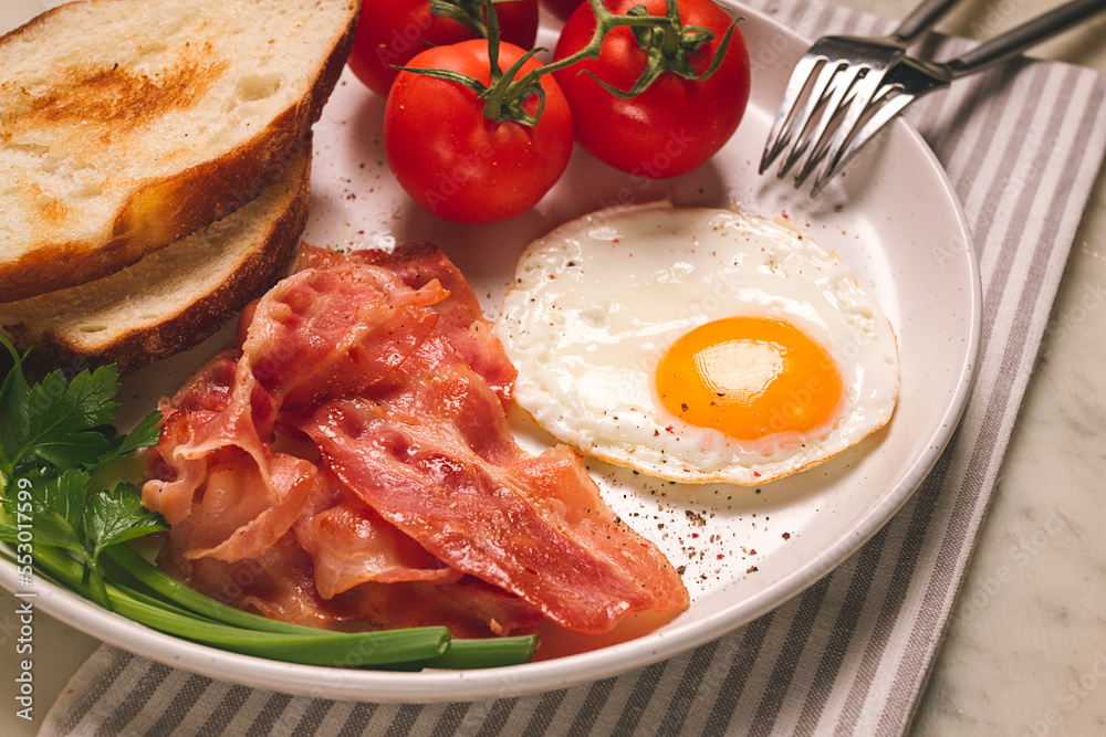 Breakfast, fried egg, bacon and bread, with cherry, on a light background, homemade, no people, Breakfast, fried egg, bacon and bread, with cherry, on a light background, homemade, no people,