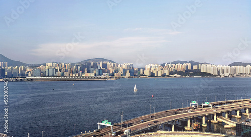 Canvas Print Panoramic landscape view of Hongkong skyline at Kowloon district, with Kai Tak Cruise Terminal and other skyscrapers at the background, taken from Hongkong Island