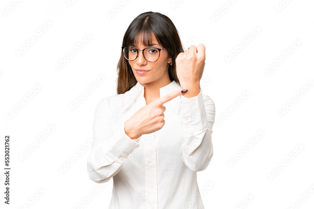 Young caucasian woman over isolated chroma key background making the gesture of being late Young caucasian woman over isolated chroma key background making the gesture of being late