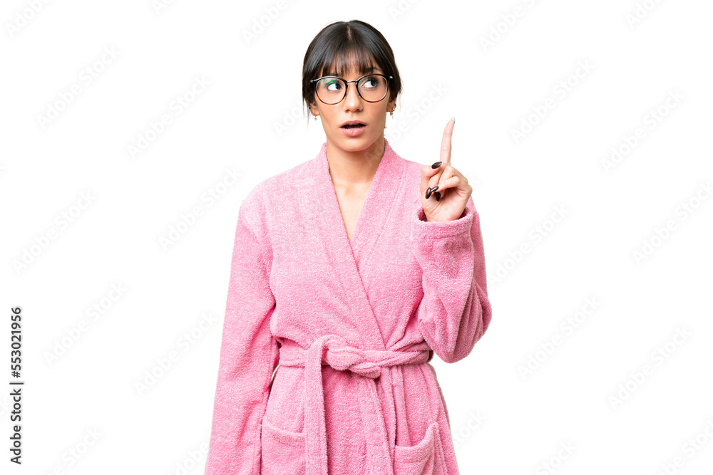Young woman in bathrobe over isolated chroma key background thinking an idea pointing the finger up Young woman in bathrobe over isolated chroma key background thinking an idea pointing the finger up