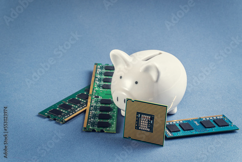 Fototapeta Naklejka Na Ścianę i Meble -  Piggy bank and computer chips. High cost of microcircuits concept