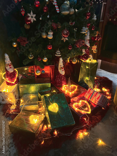 Many gift boxes tied with glowing heart shape lights