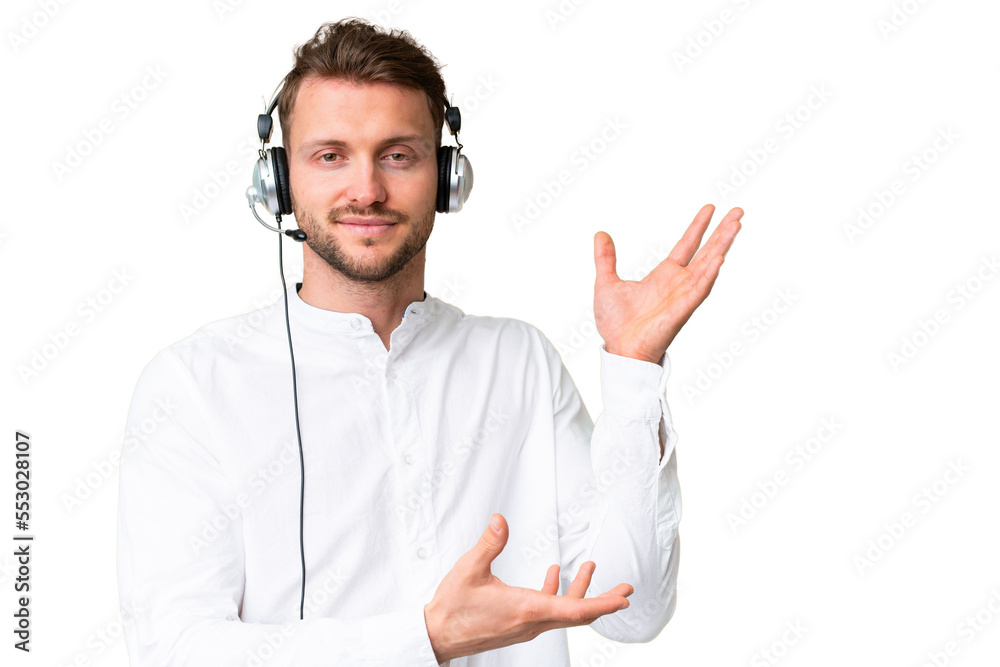 Telemarketer caucasian man working with a headset over isolated chroma key background extending hands to the side for inviting to come