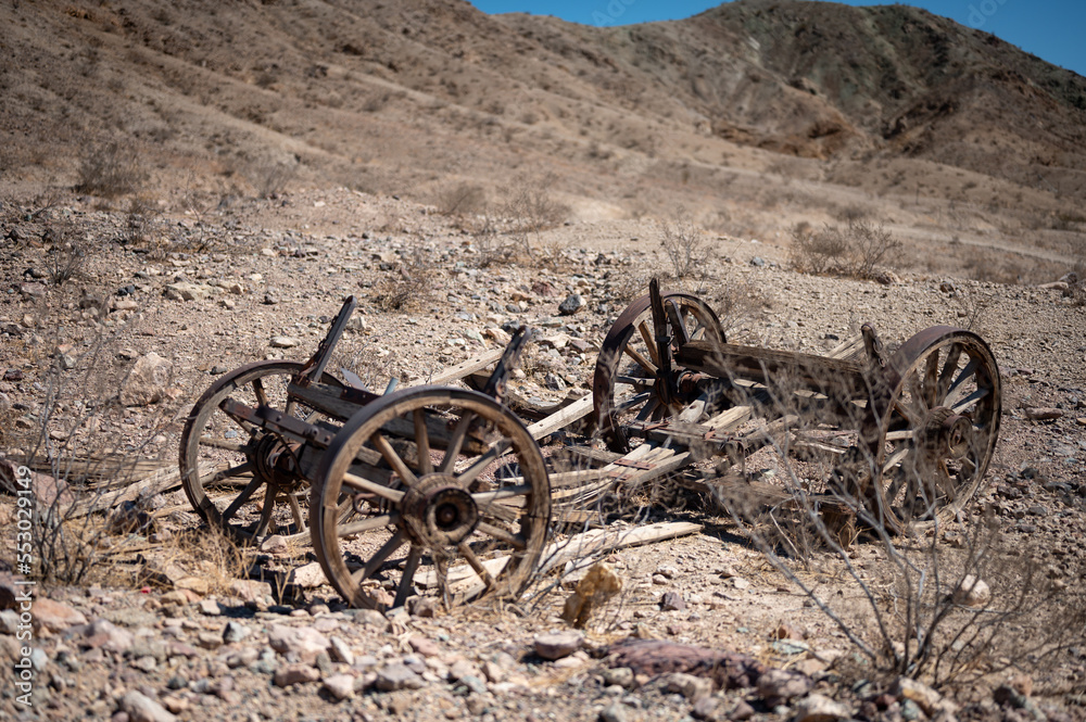 Remains of an old wooden carriage abandoned in the hot desert of the far west