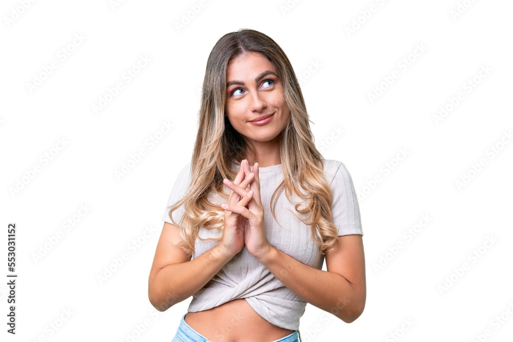 Young Uruguayan woman over isolated background scheming something - obrazy, fototapety, plakaty 