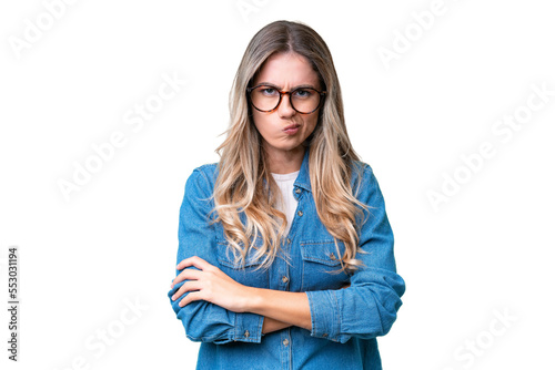 Fotografie Young Uruguayan woman over isolated background with unhappy expression