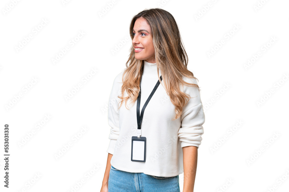 Young Uruguayan woman with ID card over isolated background looking to the side Young Uruguayan woman with ID card over isolated background looking to the side