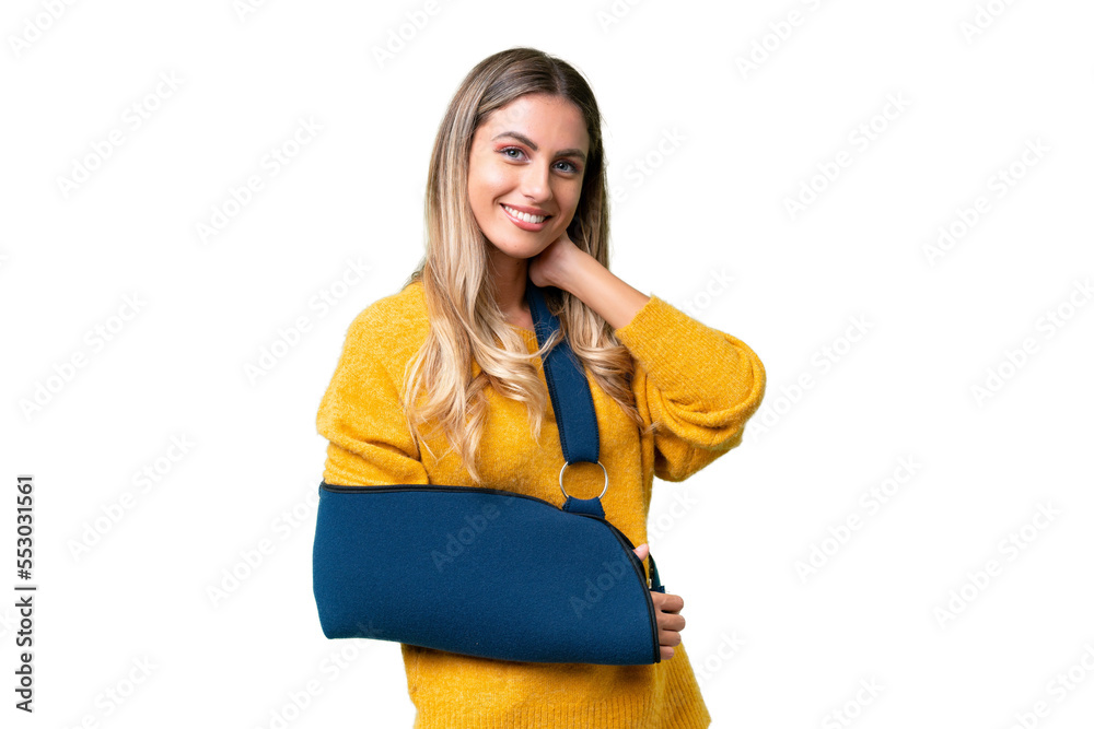 Young Uruguayan woman with broken arm and wearing a sling over isolated background laughing Young Uruguayan woman with broken arm and wearing a sling over isolated background laughing