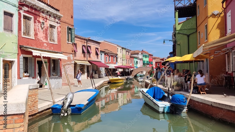 Obraz premium View of the channel of the island of Burano, colorful houses of the island of Burano, Italy. Summer landscape