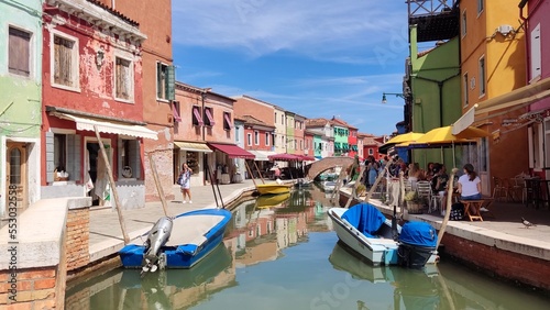View of the channel of the island of Burano, colorful houses of the island of Burano, Italy. Summer landscape