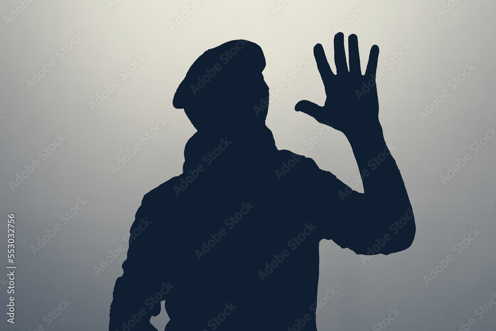 Silhouette of man waving hand in hello gesture. Anonym club concept.