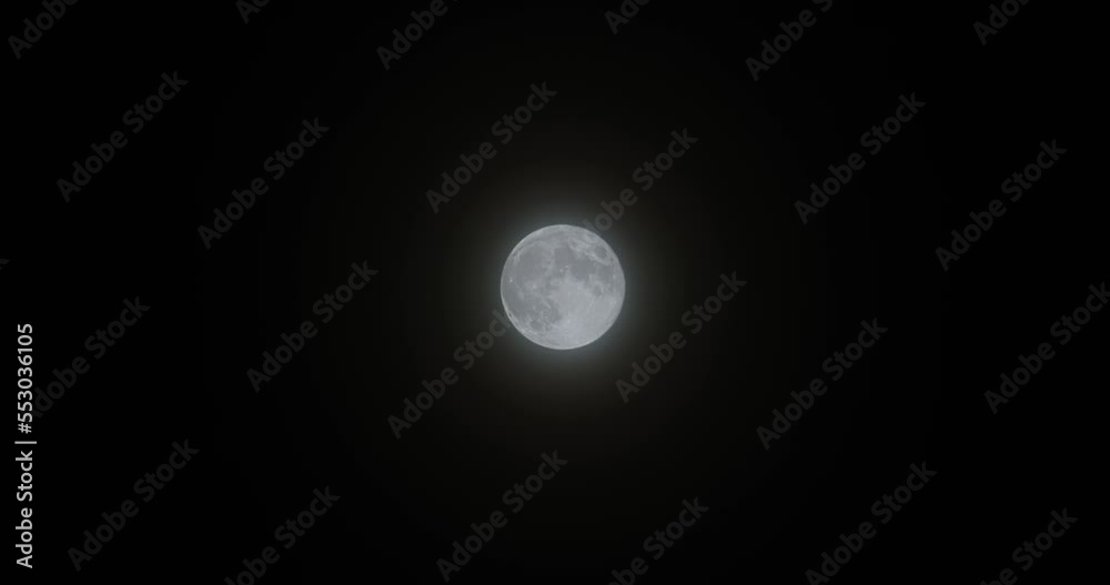 image of full moon on misty night. An image of the moon filling the screen. Detailed and sharp moon view. 6K Shooting. image of full moon on misty night. An image of the moon filling the screen. Detailed and sharp moon view. 6K Shooting.