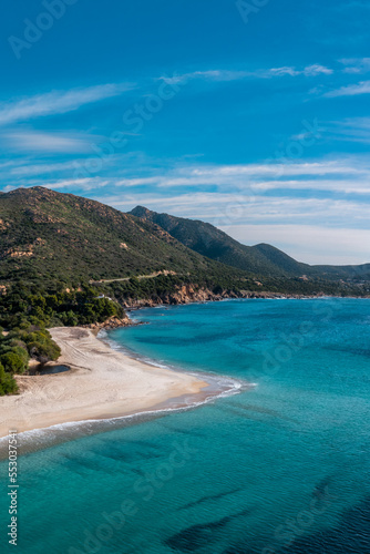 vertical view of the beautiful white sand beach and turquoise waters at Turredda Beach in Sardinia