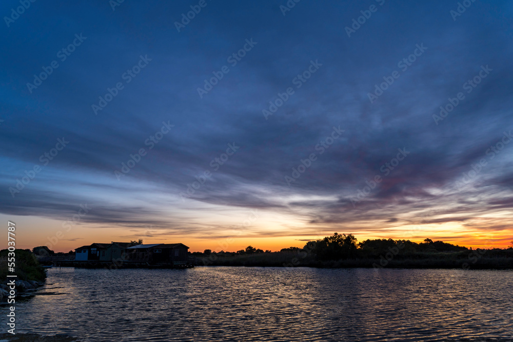Sunrise of Port des Salines with beginning colored sky and water reflection, Ile Oleron, May 2022