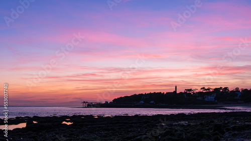 Carrelet and Lighthouse from Diable Bridge of Royan, France, during pink sunset