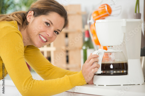 woman checking her filter coffee machine