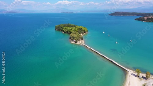 Aerial drone video of small islet of Koukoumitsa in picturesque seaside village of Vonitsa, Western Greece photo