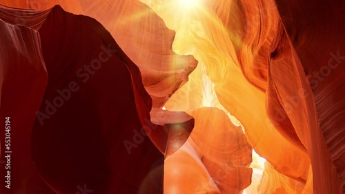 Various red and orange rocks in antelope canyon. Midday sun hits the antelope canyon whimsically illuminating canyon walls. Red walls of Antelope Canyon in Arizona, USA, United States
