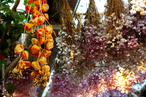 A colorful closeup of dried flowers, dried oranges, fragrant herb leaves. photo