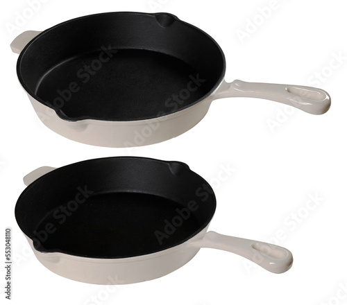 A large, cast iron frying pan for preparing food in the home kitchen. Isolated background.