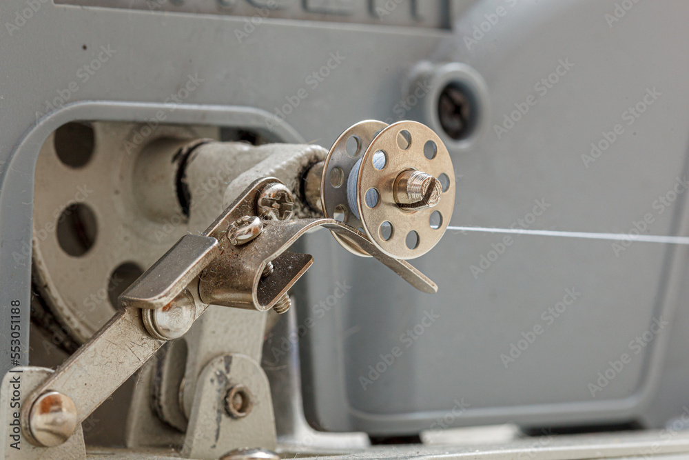 Details of a sewing machine, spool of thread Details of a sewing machine, spool of thread