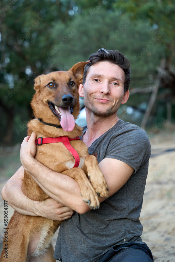 A handsome man with his lovely dog