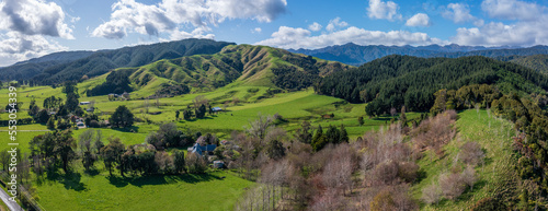 Panorama of the foothills and Tararua ranges From Gladstone Rd near Levin in Horowhenua in New Zealand. Showing farmland, rural housing, bush and forest with some trees in winter colours