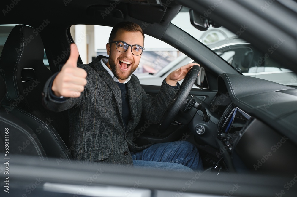 His true love. Portrait of a mature man smiling happily sitting in a brand new car