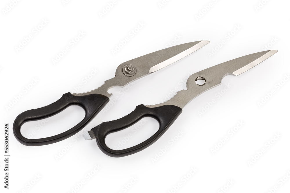Two halves of detached kitchen scissors on a white background Two halves of detached kitchen scissors on a white background