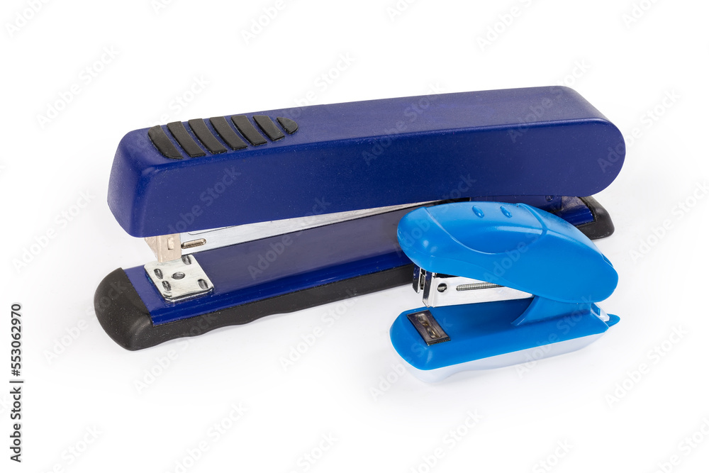 Two small and big paper staplers on a white background Two small and big paper staplers on a white background