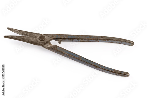 Old used tin snips on a white background