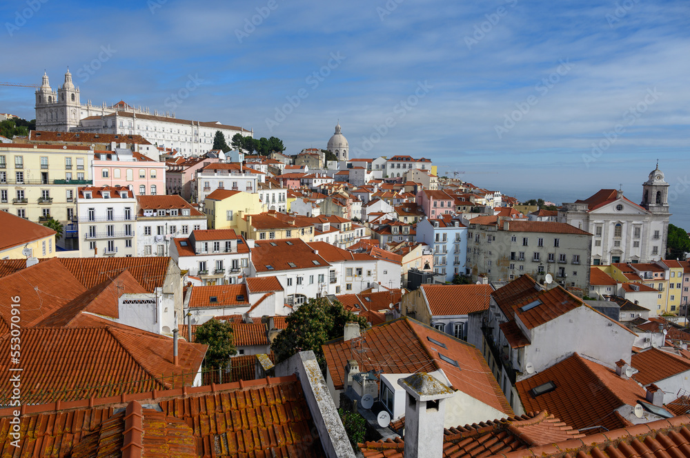 Lisbon, Portugal, November 6, 2022. View from viewpoint terrace on old part of Lisbon in Alfama, white houses with tiled roofs, river Tejo, port Lisbon, Portugal, November 6, 2022. View from viewpoint terrace on old part of Lisbon in Alfama, white houses with tiled roofs, river Tejo, port