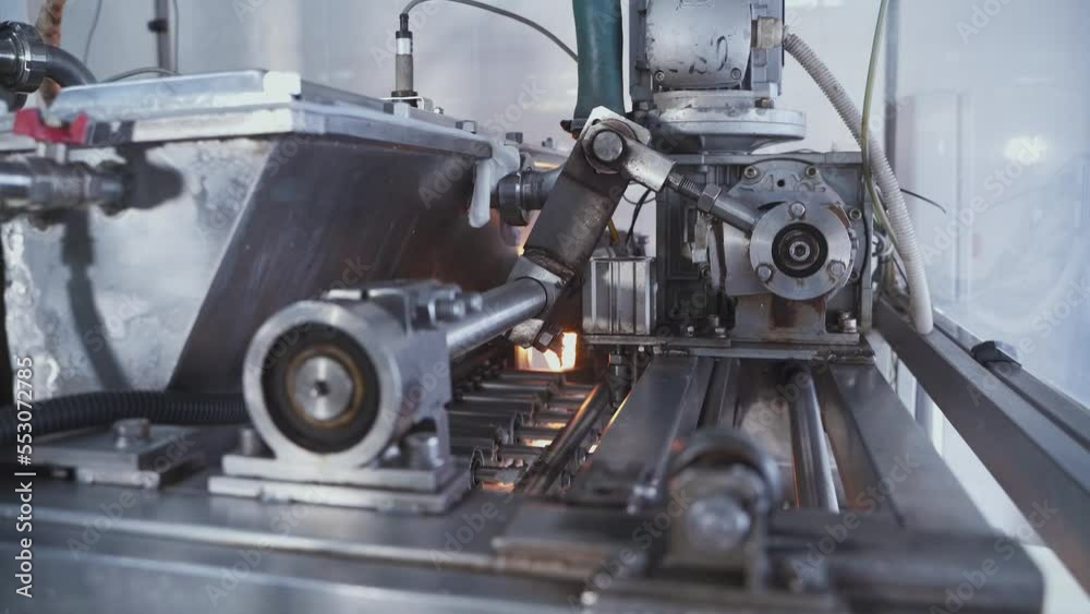 Automatic machine for the production of marshmallows. Rotating shaft and pistons of an automatic conveyor machine in a confectionery factory.