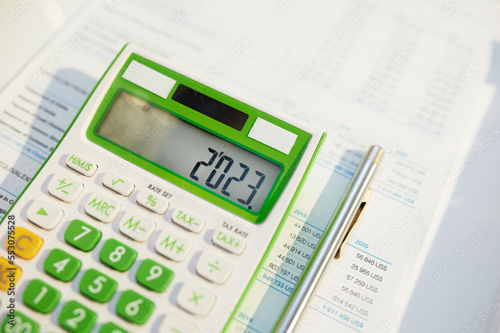 tax time. calculator and documents on table tax time. calculator and documents on table