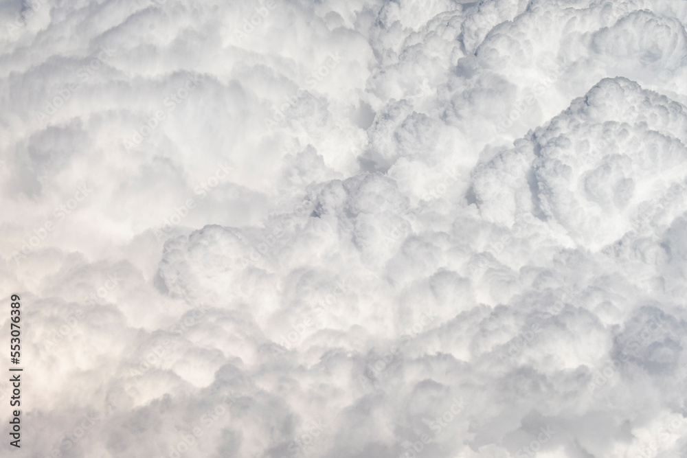 Fototapeta premium Clouds. View through an airplane window.