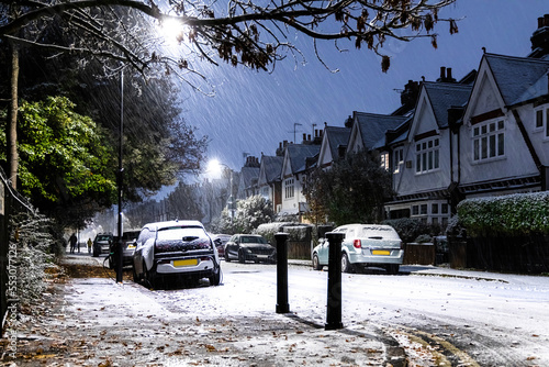 Snowy night in West London suburb at Christmas time photo