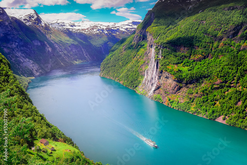 Peaceful Geirangerfjord with boat and waterfall, Norway , Scandinavia photo