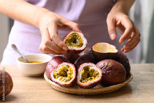 Passion fruit in hand preparing for cooking, Healthy eating, Tropical fruit in summer season