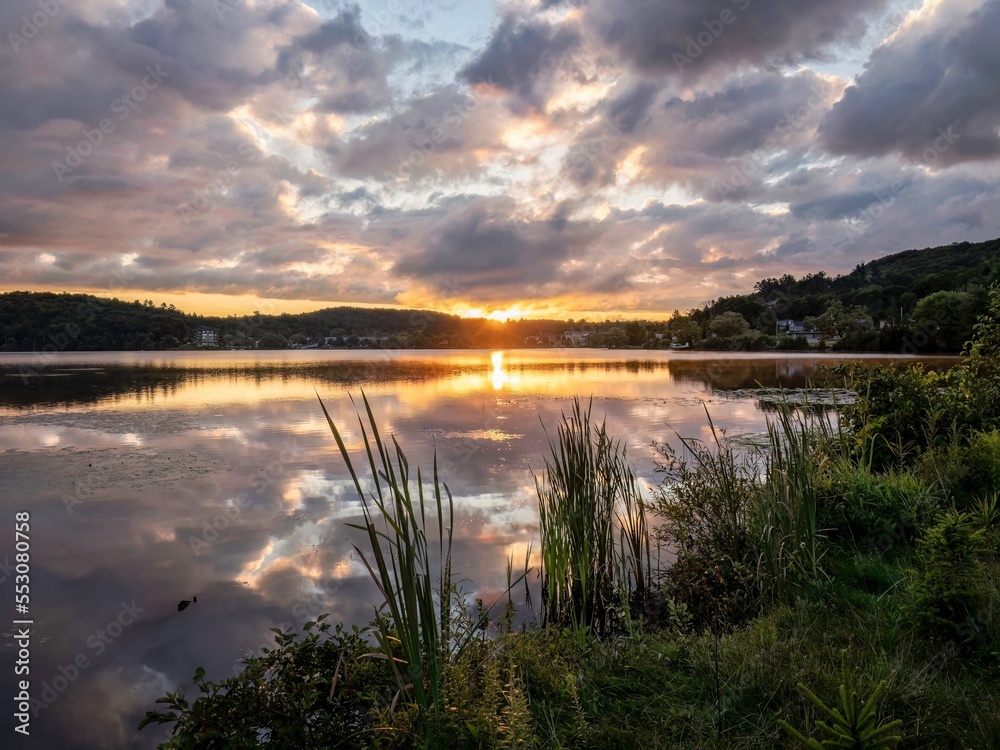 During the summer a sunrise appears across Head Lake in Haliburton, Ontario, Canada