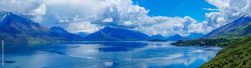Panoramic view of beautiful reflections in alpine lake