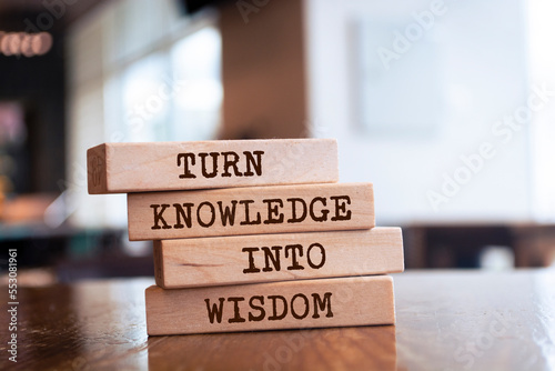 Wooden blocks with words 'Turn Knowledge into Wisdom'. photo