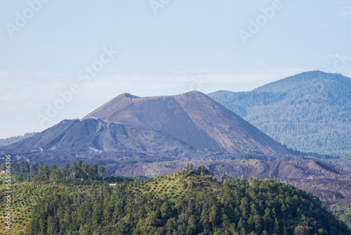 The landscape of Paricutin Volcano in Michoacan, Mexico. View of the mountains, a volcano ans the sky. 