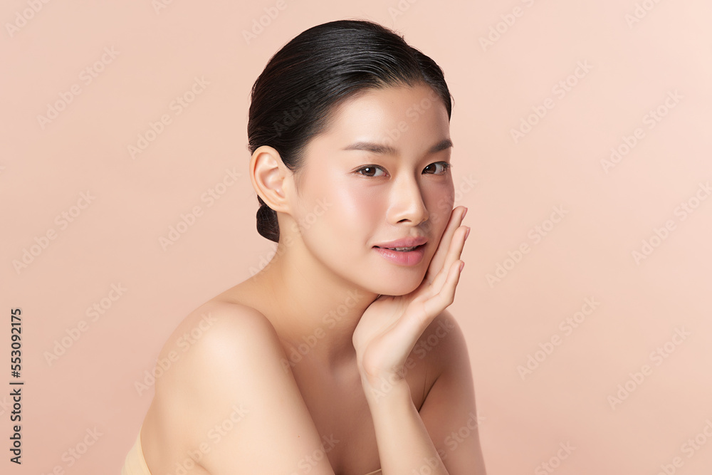 Beautiful young asian woman with clean fresh skin on beige background, Face care, Facial treatment, Cosmetology, beauty and spa, Asian women portrait.