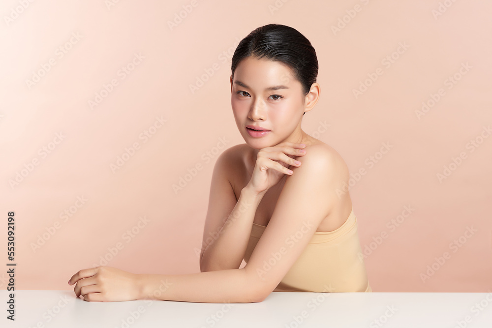 Beautiful young asian woman with clean fresh skin on beige background, Face care, Facial treatment, Cosmetology, beauty and spa, Asian women portrait. Beautiful young asian woman with clean fresh skin on beige background, Face care, Facial treatment, Cosmetology, beauty and spa, Asian women portrait.