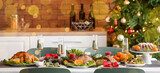 Dining table served for festive Christmas dinner in kitchen