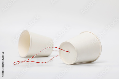 Implementing the concept of a communication system using white paper cups and strings