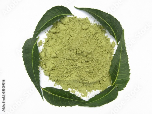 Neem leaves powder in a bowl isolated on white background 