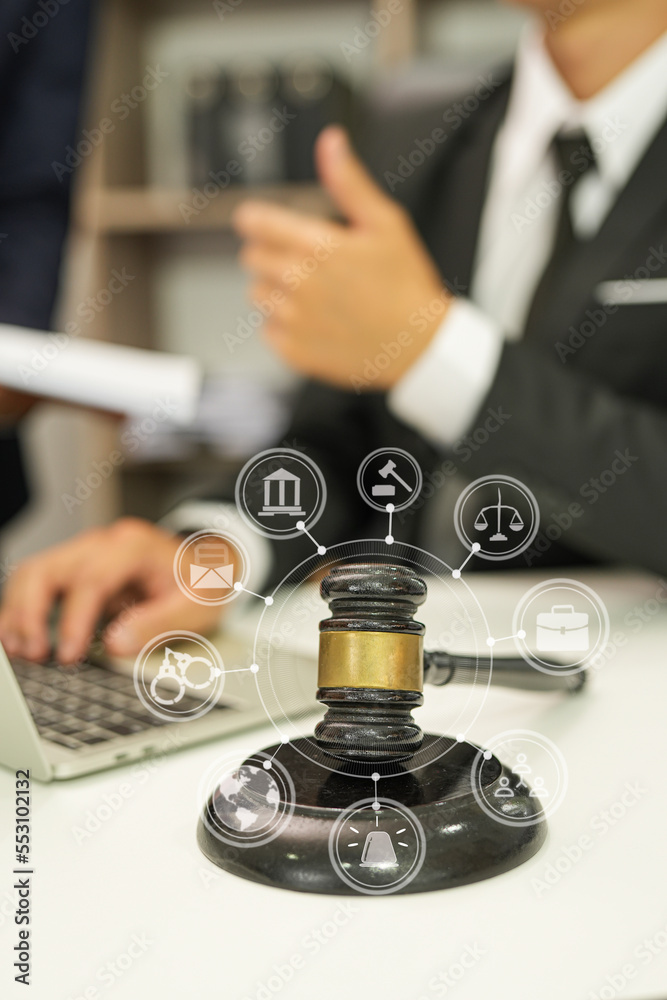 judge on wooden table And experienced lawyers meet with clients and give advice behind the scenes. legal services legal consulting concept judge on wooden table And experienced lawyers meet with clients and give advice behind the scenes. legal services legal consulting concept