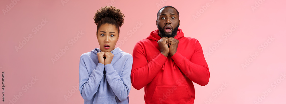 Upset worried two siblings watching together scary disturbing horror movie  gasping frowning cringing shock intense emotions press hands chest widen  eyes terrified standing nervous pink background Stock Photo | Adobe Stock