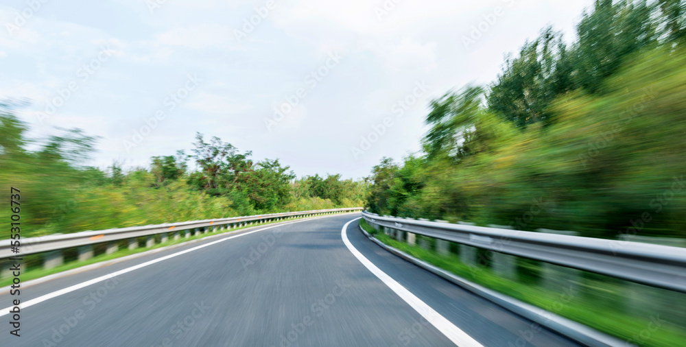 Empty curved road in motion blur Empty curved road in motion blur